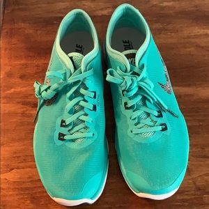 Nike: Teal tennis shoes. Never worn.